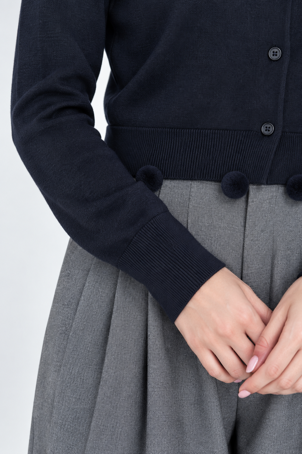 Gilet en tricot à pompons