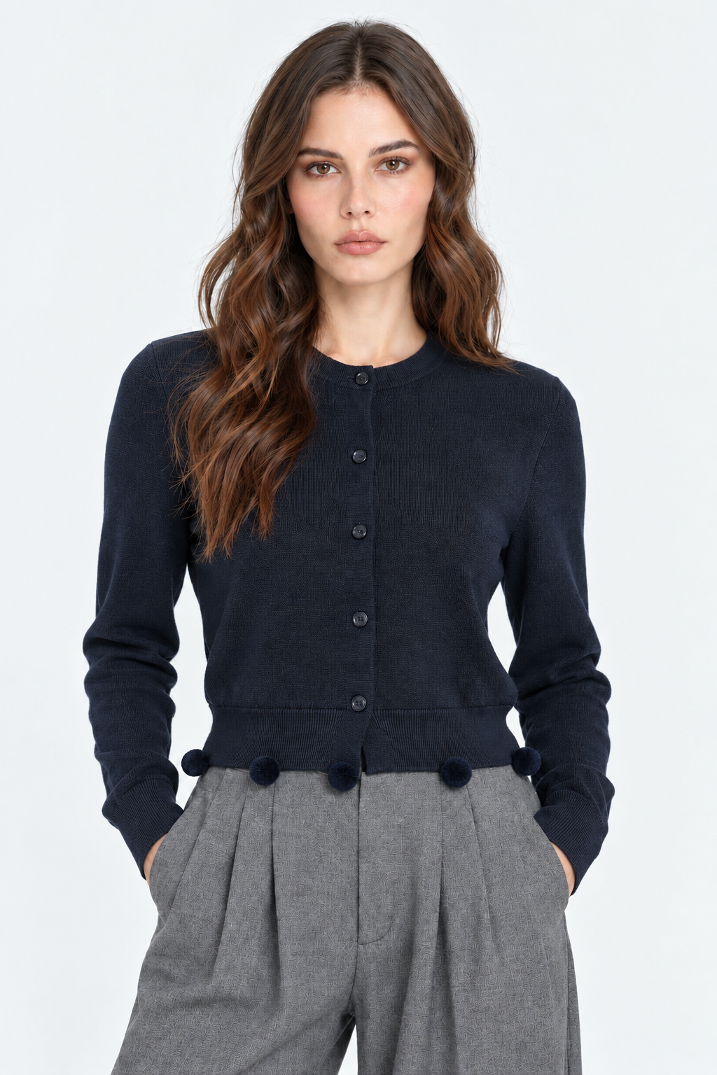 Gilet en tricot à pompons
